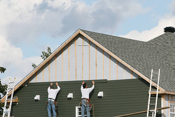 Professional Storm Damage Siding Repair technician working in Williamstown, PA